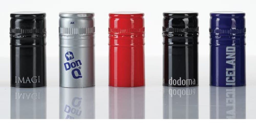Long aluminium ROPP caps decorated for spirits brands